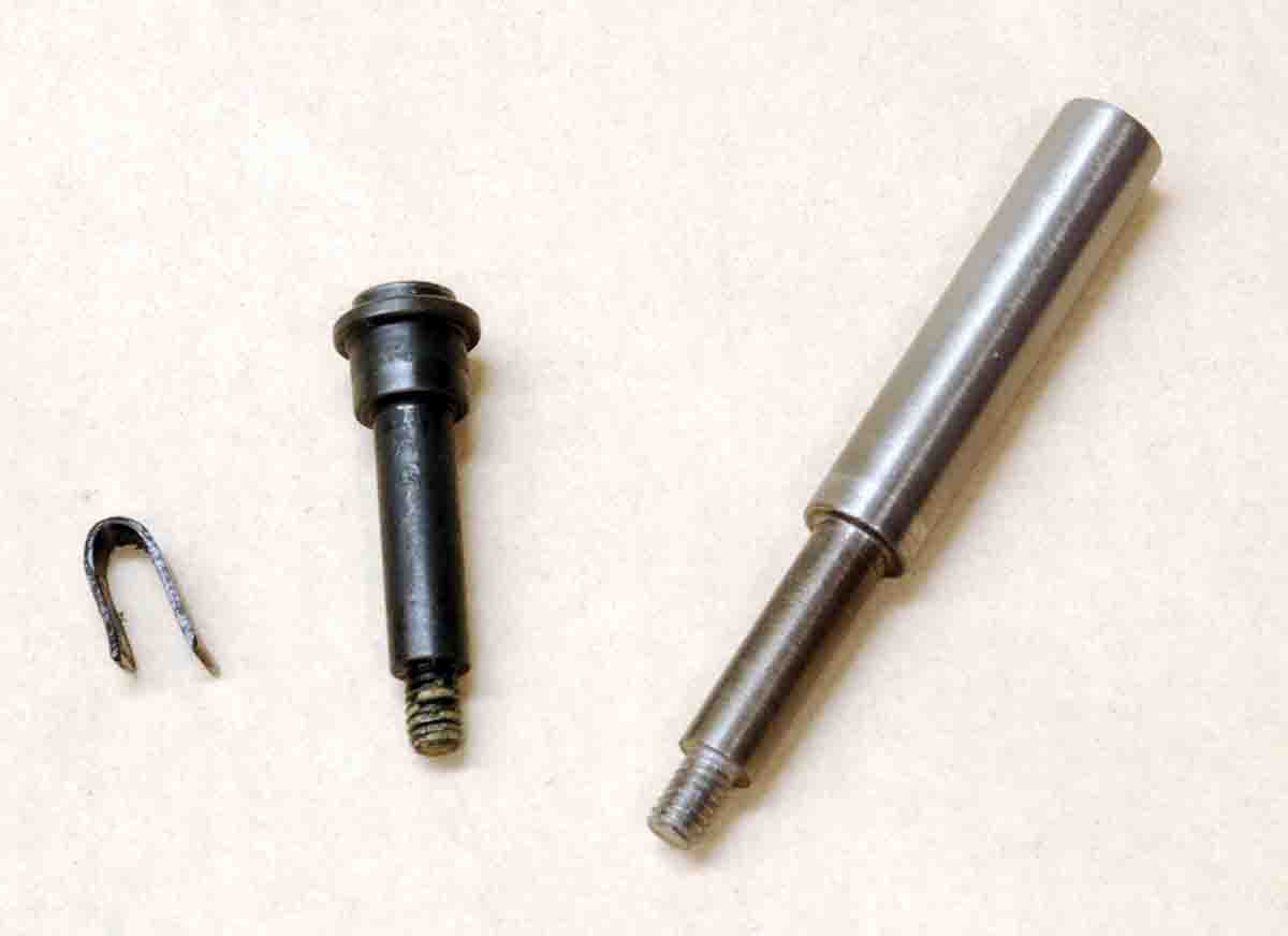Shown (left to right) is a U-clip, factory axle screw and fabricated axle screw used for magazine disassembly.